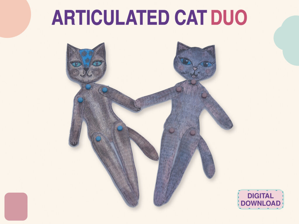 Two hand-drawn articulated paper cats from the cat paper doll set, joined with brads and holding paws, one with a blue flower pattern on the forehead; text Articulated Cat Duo, digital download