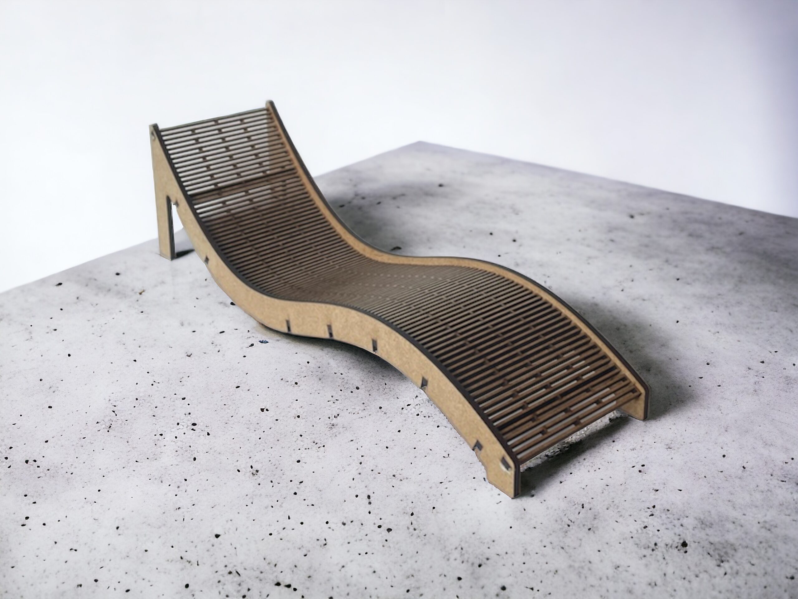 Slatted curved miniature chaise lounge in natural brown board, 1:6 scale, on a grey surface